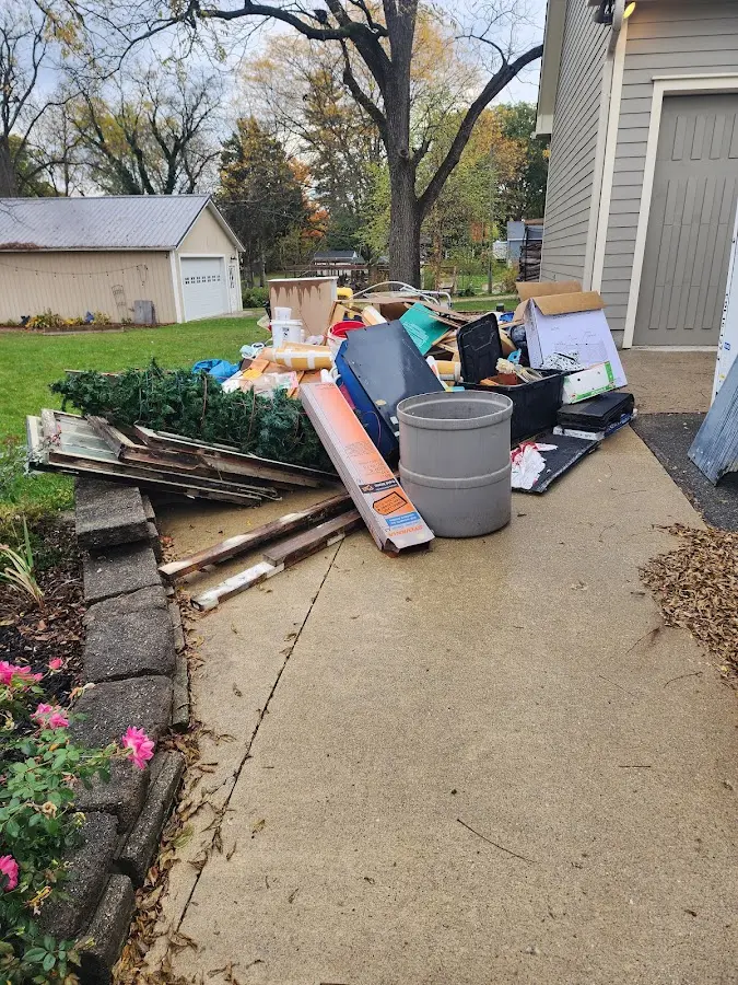 Dumpster being loaded with debris for 30 Yard Dumpster Rental in Lugoff